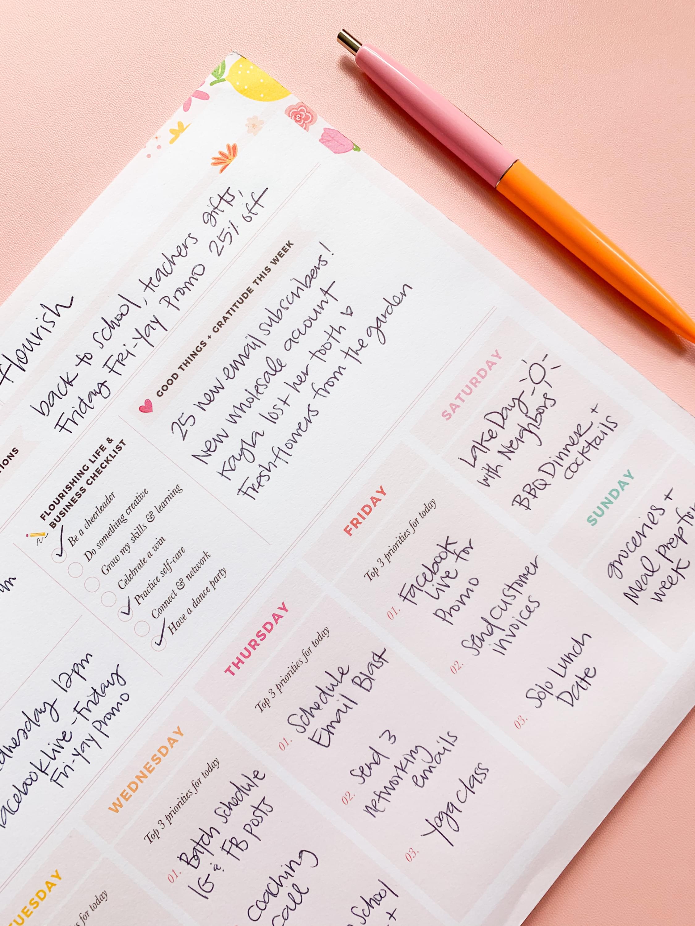 Free weekly business planner on desk
